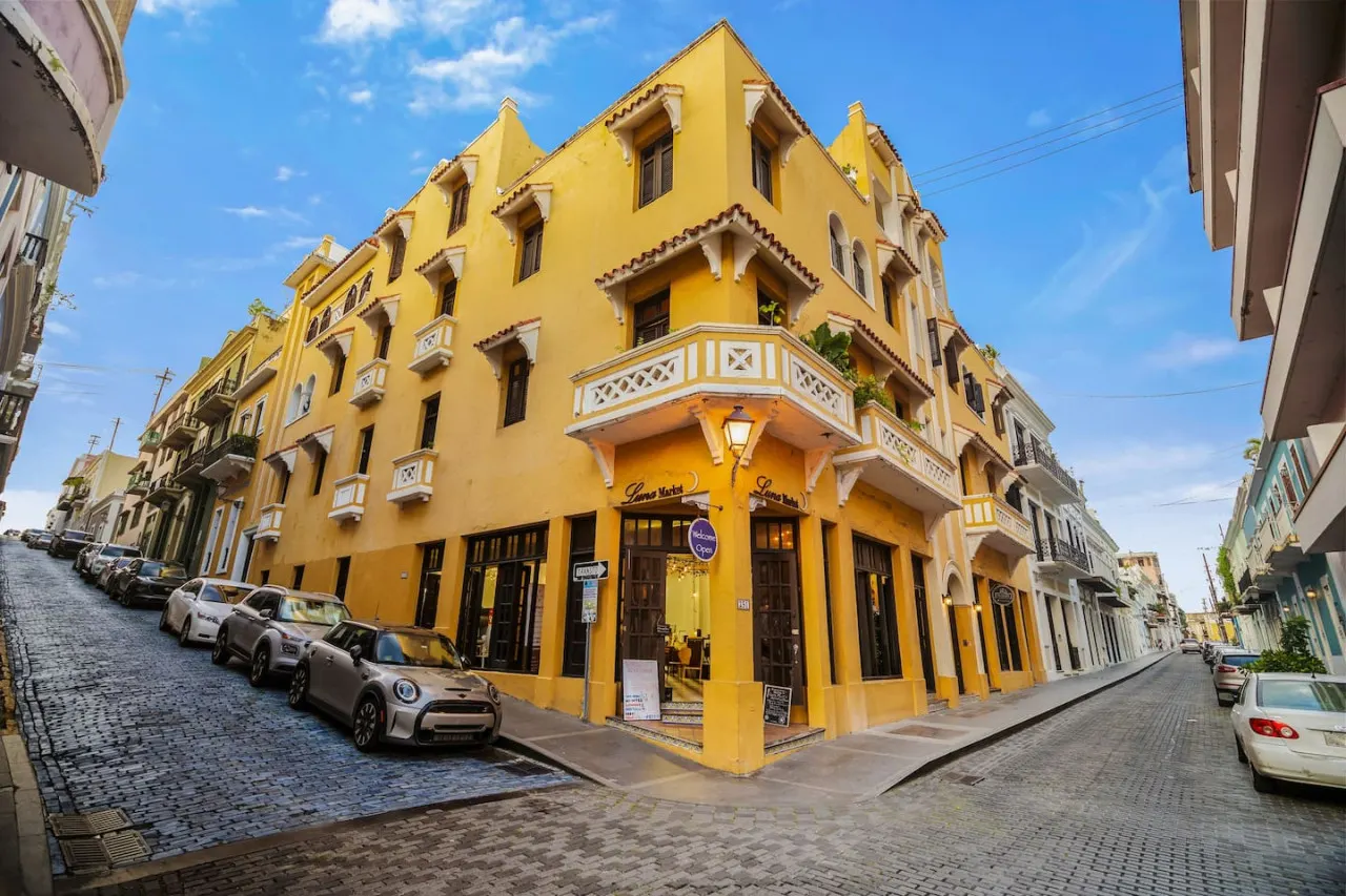 Yellow building with a balcony — Spanish Penthouse Historic Mansion Private Patio, Old San Juan